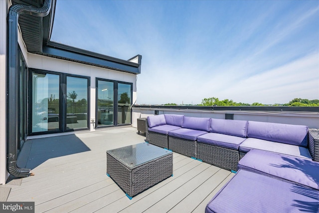 wooden deck featuring an outdoor hangout area