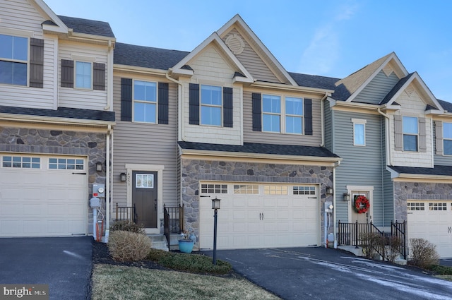 multi unit property featuring a garage