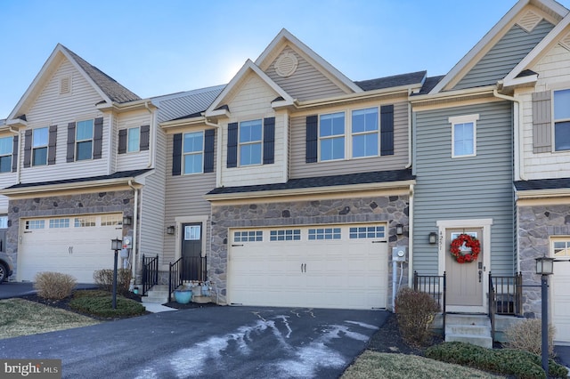 townhome / multi-family property with a garage