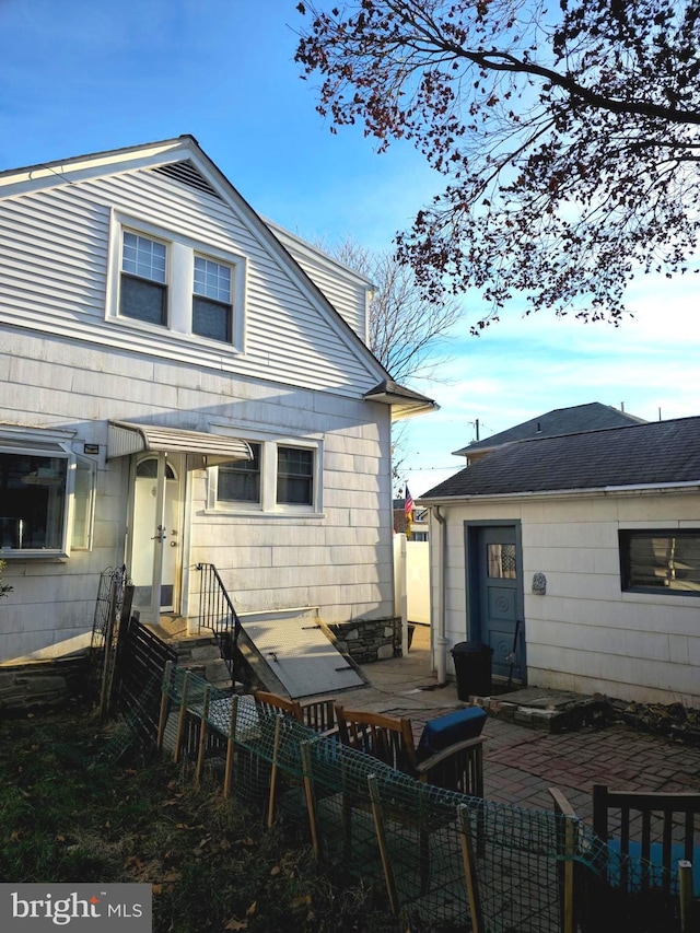 rear view of property with a patio