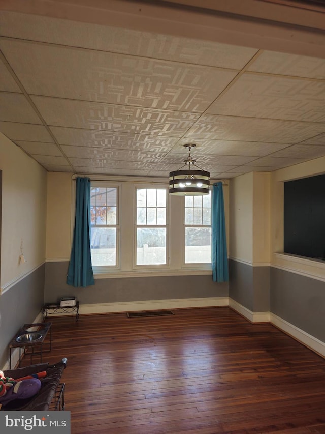 empty room with dark wood-type flooring