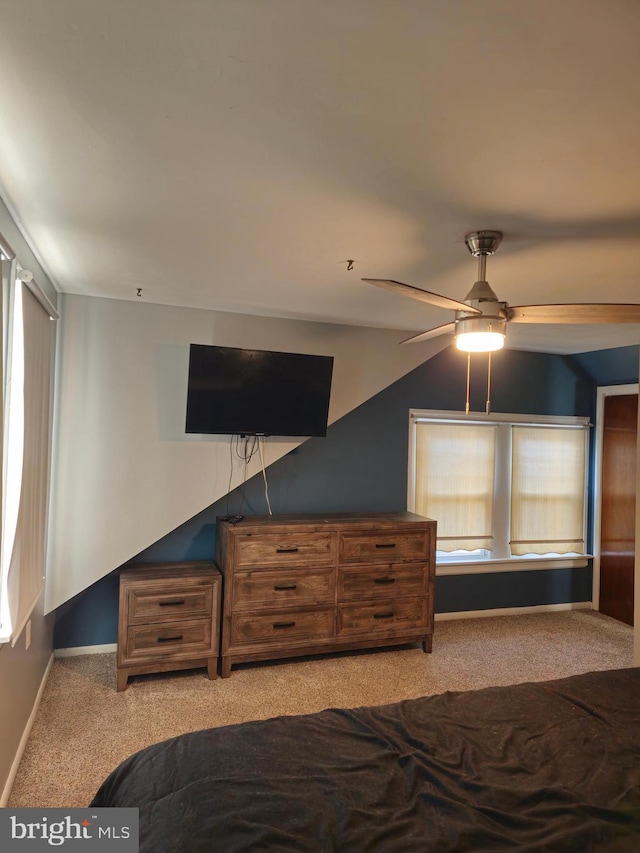 unfurnished bedroom with light carpet and ceiling fan