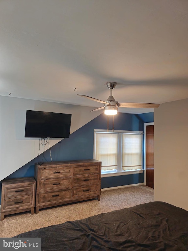 bedroom with ceiling fan and light carpet