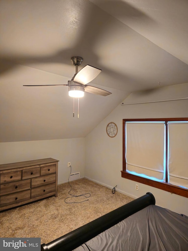 carpeted bedroom featuring ceiling fan and lofted ceiling