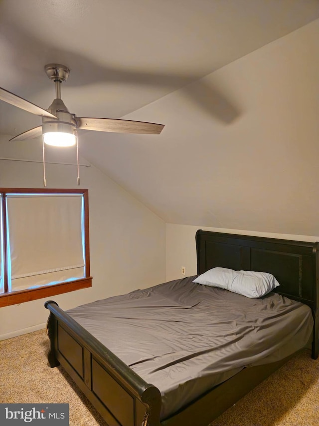 bedroom featuring light colored carpet, ceiling fan, and lofted ceiling