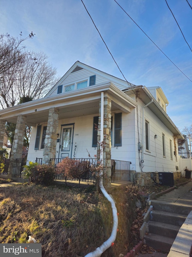 view of front of property featuring a porch and central air condition unit