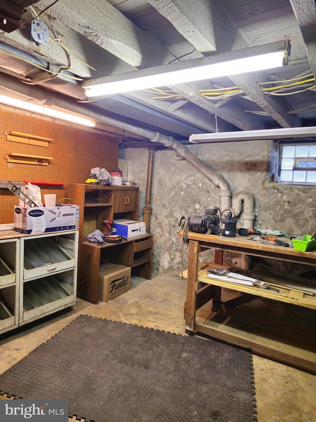 basement with a workshop area