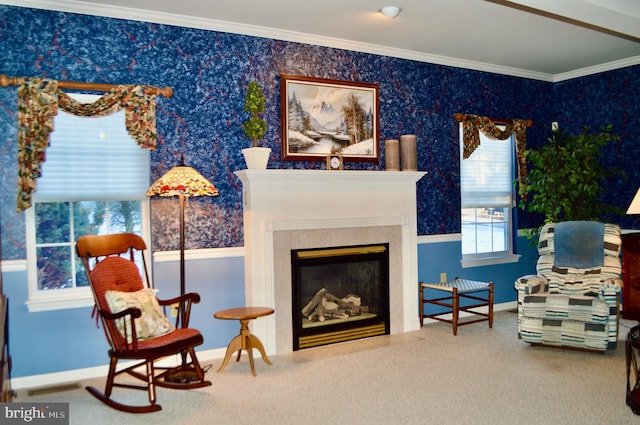 sitting room with a fireplace, carpet, and ornamental molding