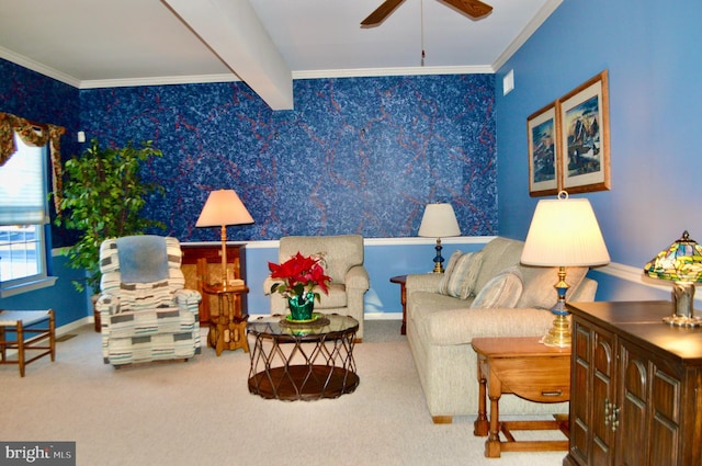 living area featuring carpet, beamed ceiling, ceiling fan, and ornamental molding