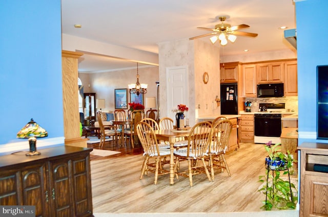 dining room with ceiling fan with notable chandelier, light hardwood / wood-style floors, and ornamental molding