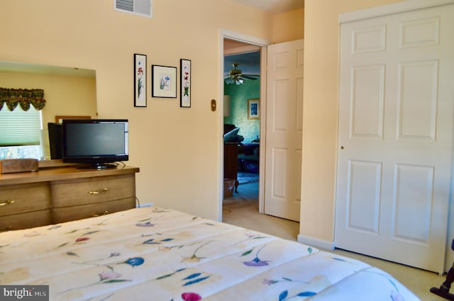 bedroom featuring light colored carpet