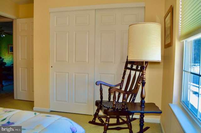 sitting room featuring ceiling fan