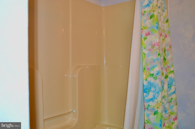 bathroom with a shower with shower curtain