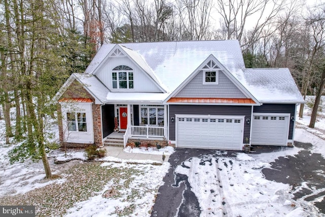 view of front of home with a garage and covered porch