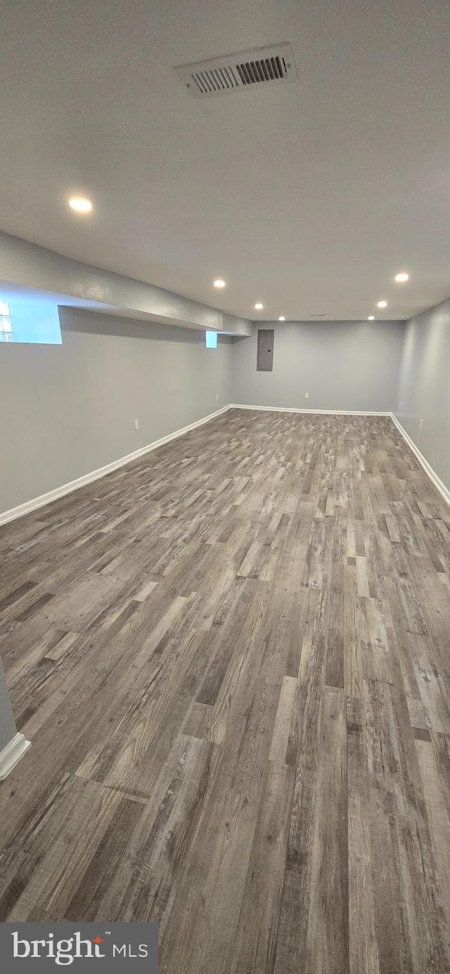 basement featuring hardwood / wood-style floors