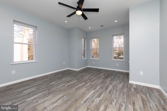 empty room featuring ceiling fan and hardwood / wood-style floors