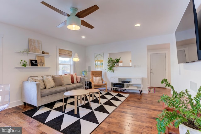 living room with ceiling fan and wood-type flooring