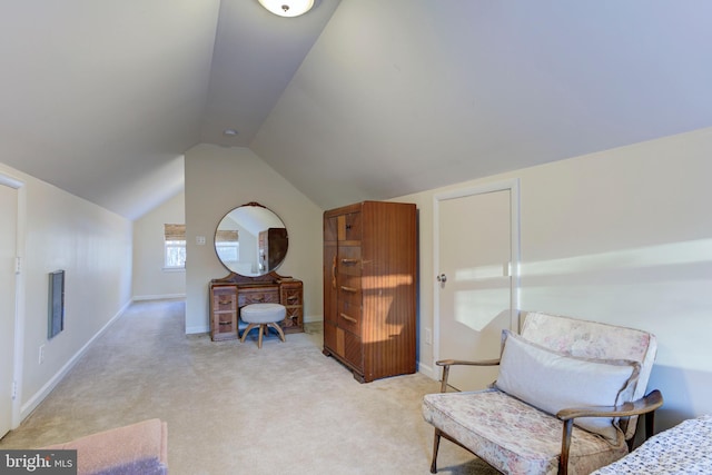 living area featuring light colored carpet and vaulted ceiling