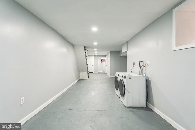 washroom with washing machine and clothes dryer