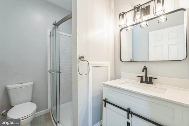 bathroom featuring toilet, vanity, an enclosed shower, and tile patterned floors