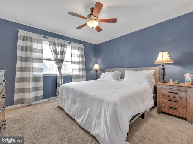 bedroom with light colored carpet and ceiling fan