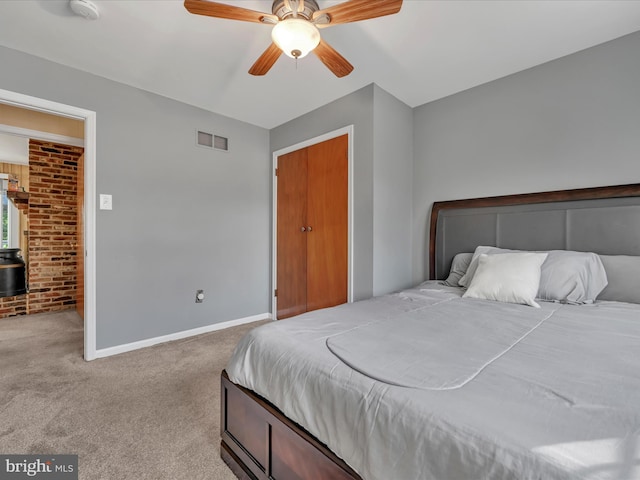 bedroom featuring carpet flooring, ceiling fan, and a closet