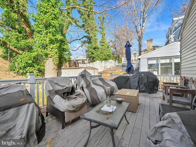 wooden deck with area for grilling