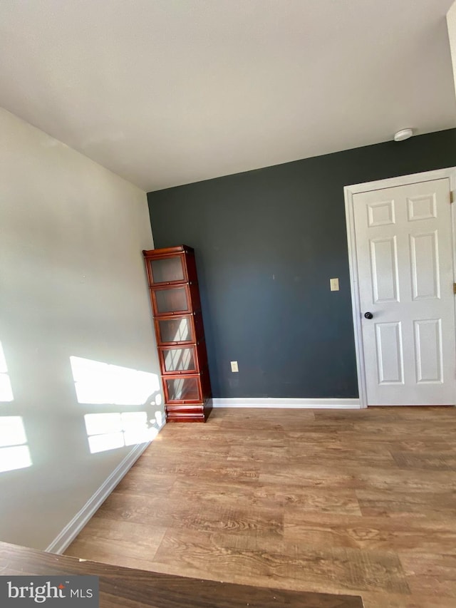 unfurnished room with light hardwood / wood-style floors