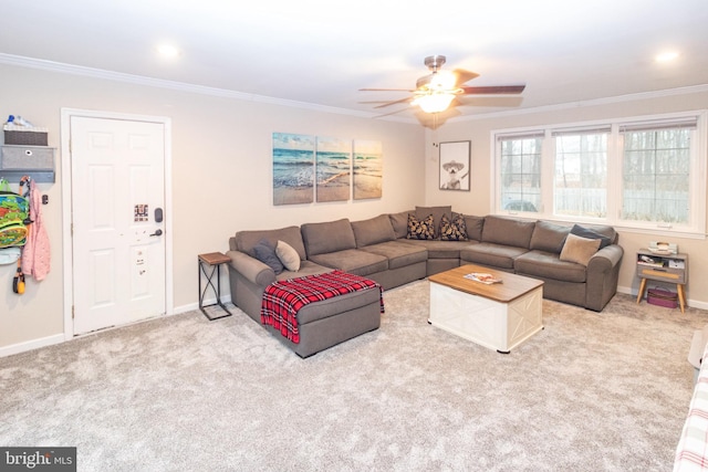 living room featuring ornamental molding, carpet, and ceiling fan