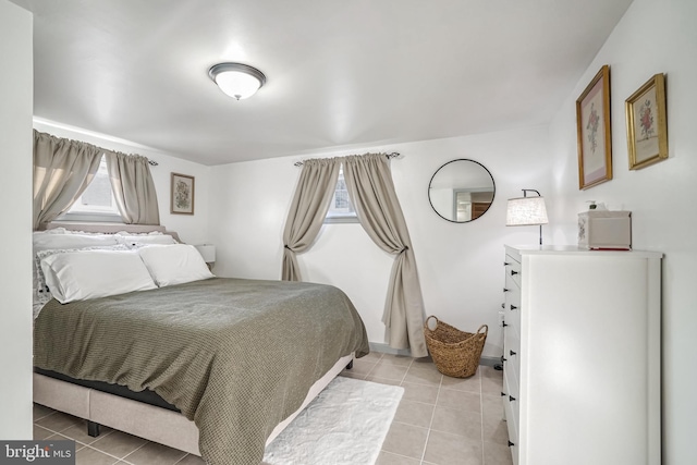 bedroom featuring light tile patterned floors