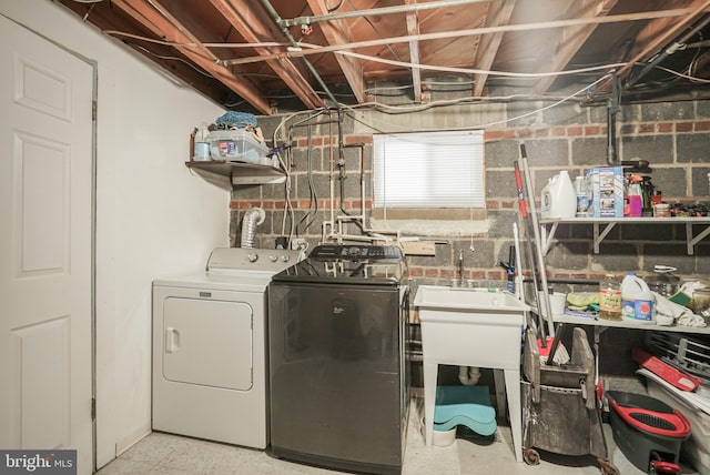 laundry area with separate washer and dryer