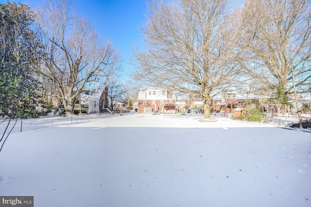 view of yard layered in snow