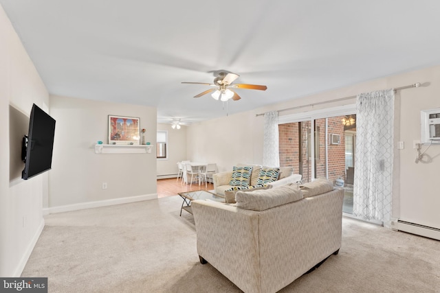 carpeted living room with baseboard heating and ceiling fan