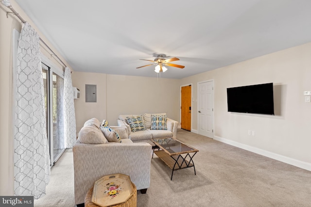 living room with ceiling fan, light colored carpet, and electric panel