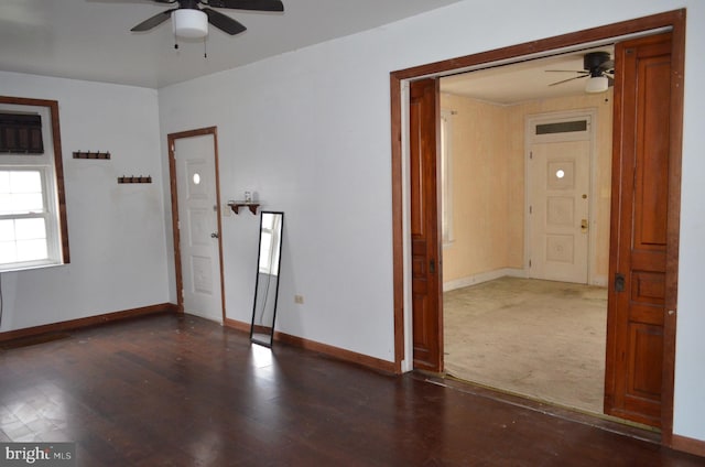 spare room with ceiling fan and dark hardwood / wood-style floors