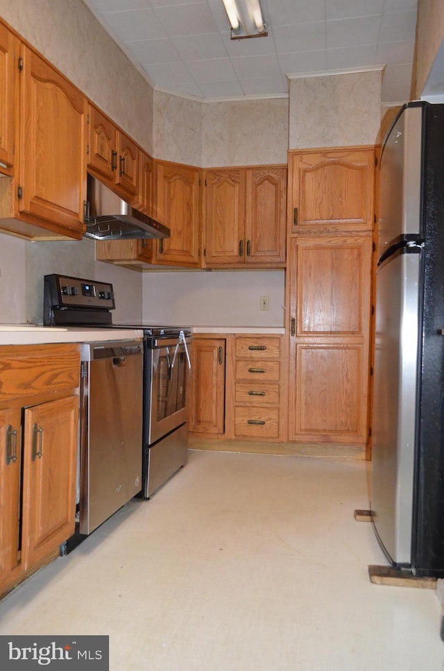 kitchen with range and stainless steel refrigerator