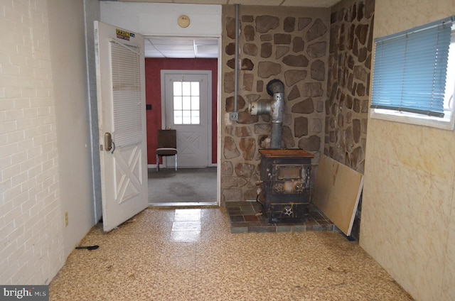 entryway featuring a wood stove