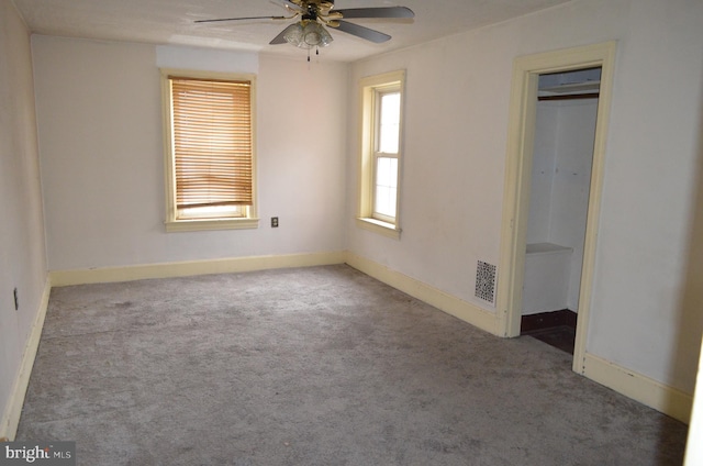 unfurnished bedroom featuring a closet, light colored carpet, and ceiling fan