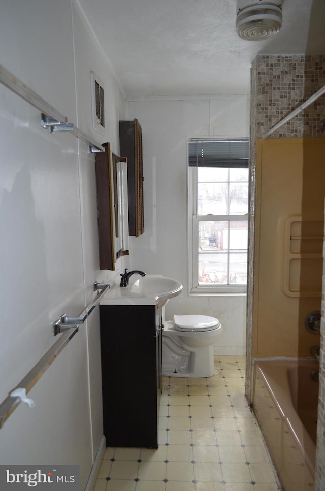 full bathroom featuring shower / tub combination, vanity, and toilet