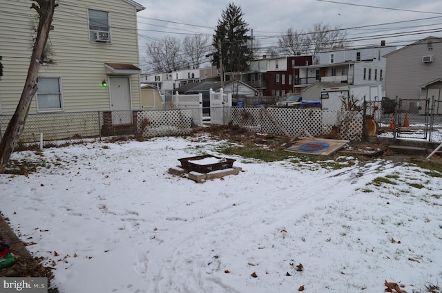 view of yard layered in snow