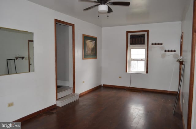 unfurnished room with ceiling fan and dark hardwood / wood-style floors