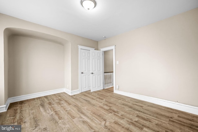 spare room featuring light hardwood / wood-style floors