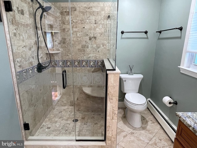 bathroom featuring walk in shower, vanity, toilet, and baseboard heating