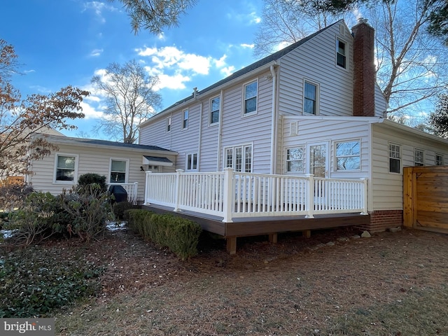 back of property featuring a deck