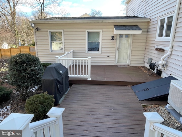 deck with central air condition unit and area for grilling