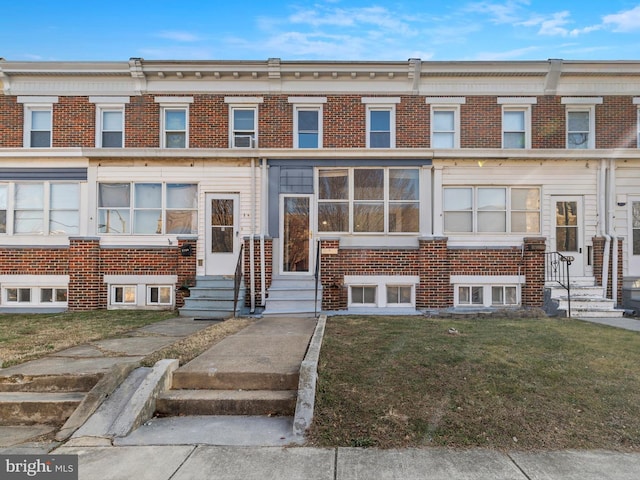 view of property with a front lawn