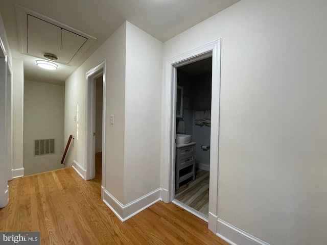 hall with light wood-type flooring