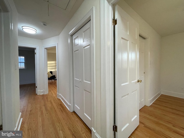 hall with light wood-type flooring