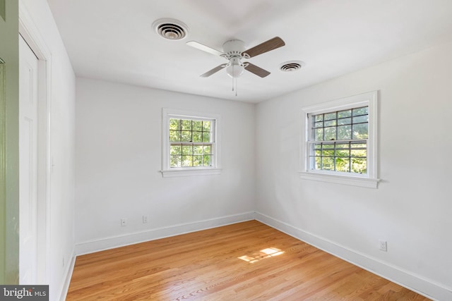 spare room with ceiling fan and light hardwood / wood-style floors