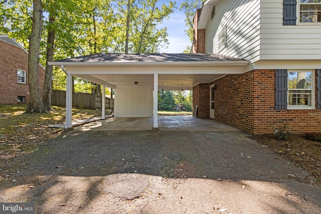 view of side of property with a carport